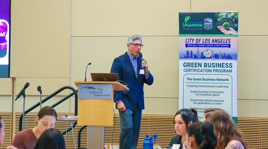 Los Angeles Sanitation and Environment’s (LASAN) Manuel Montano welcomes certified green business leaders in the city of Los Angeles at the LASAN Green Business Program Expo on Tuesday, September 23rd at The California Endowment.  (Jose Lozano/LASAN)