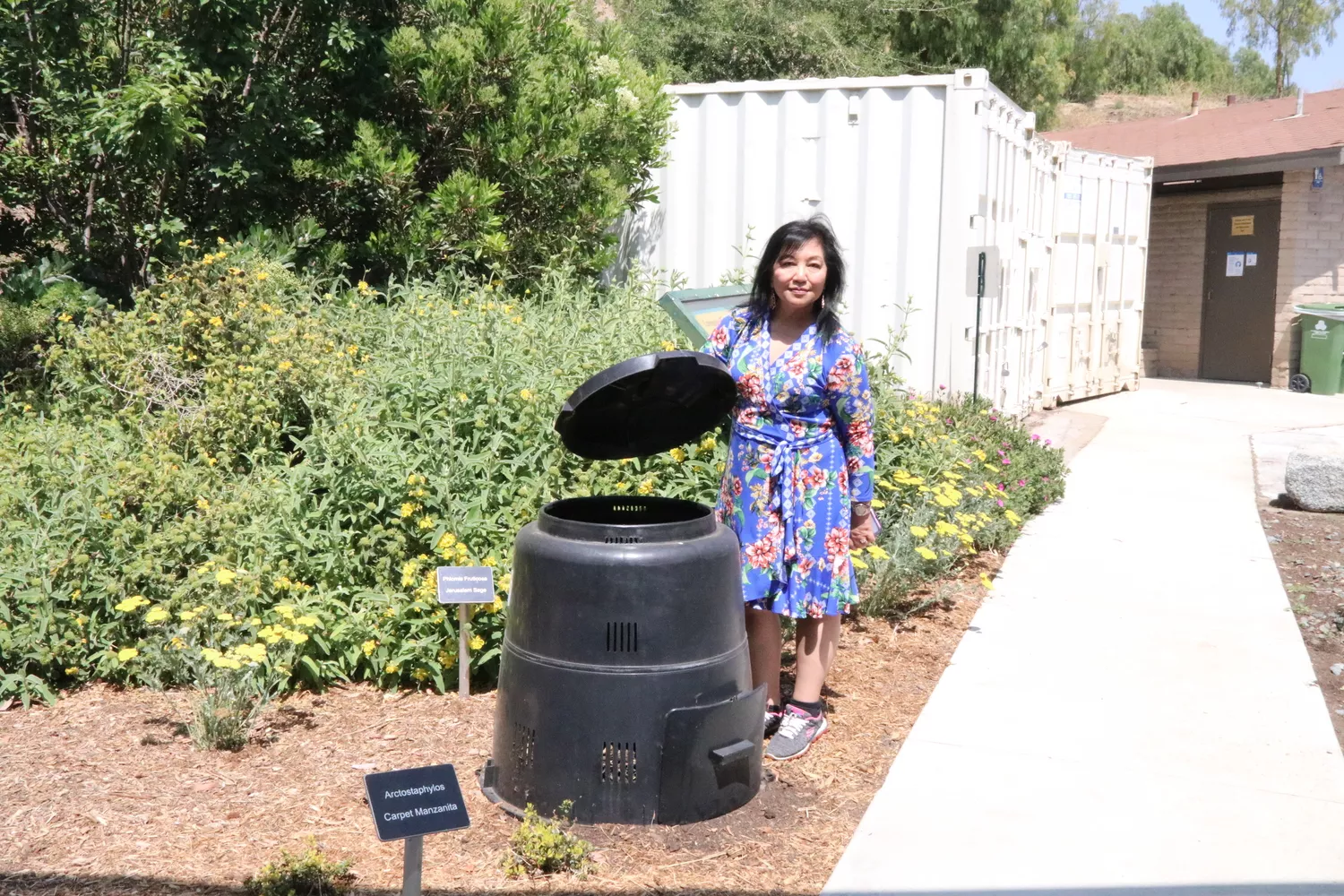 Commissioner Reyes with a composting bin