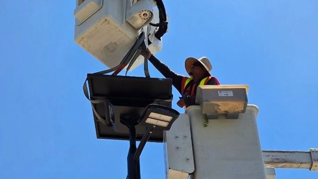 BSL FOD worker installing solar light