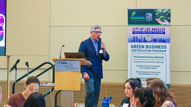 Los Angeles Sanitation and Environment’s (LASAN) Manuel Montano welcomes certified green business leaders in the city of Los Angeles at the LASAN Green Business Program Expo on Tuesday, September 23rd at The California Endowment. (Jose Lozano/LASAN)